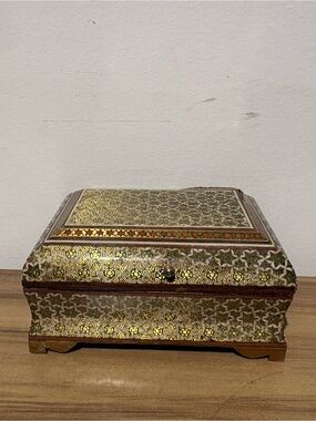 Handcrafted Gold Patterned Decorative Jewelry Box some withering on one side .